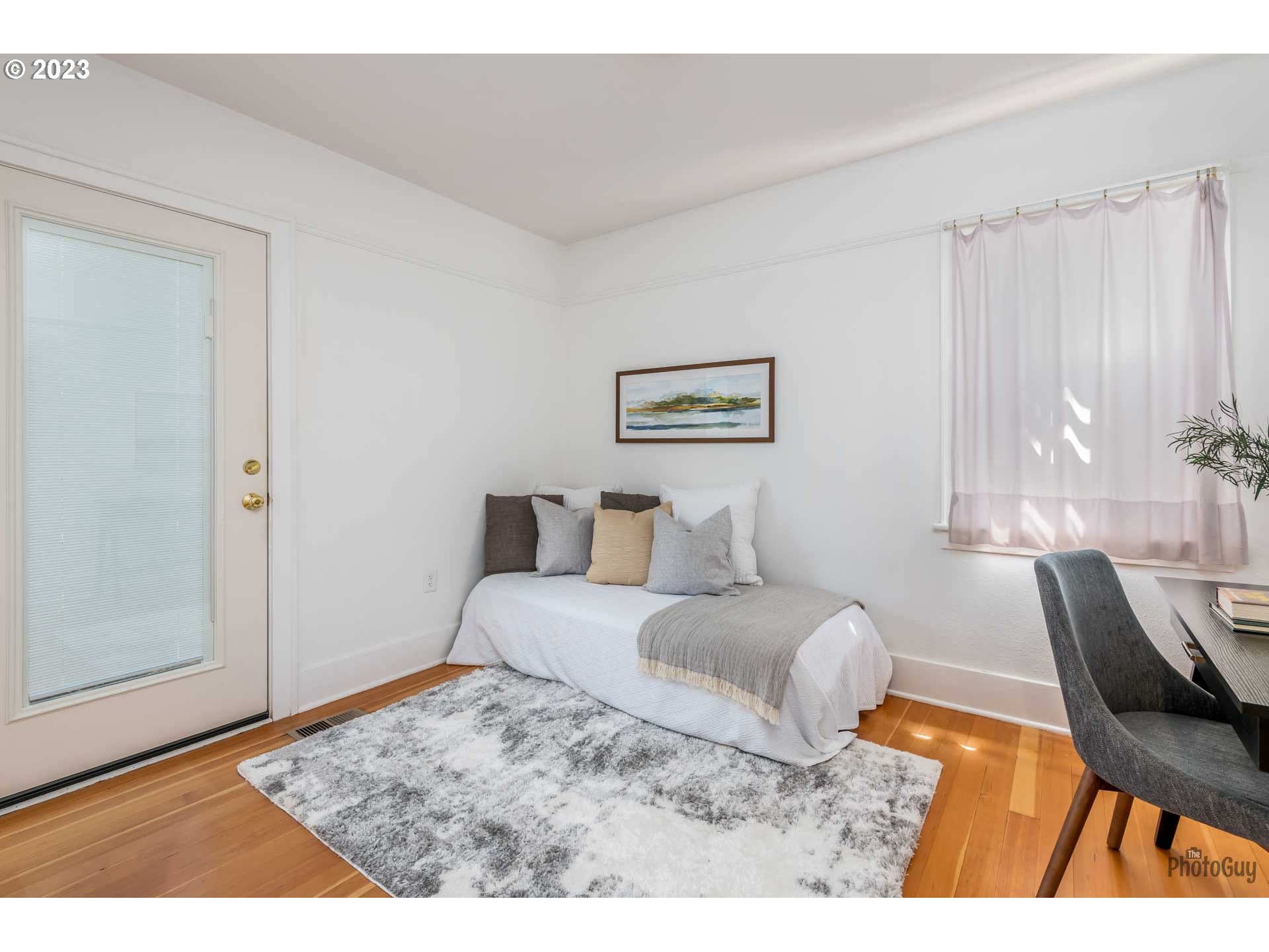 1041 Madison Street Eugene, OR 97402 - Photo 19 of 34 a bedroom with a bed a couch and a window