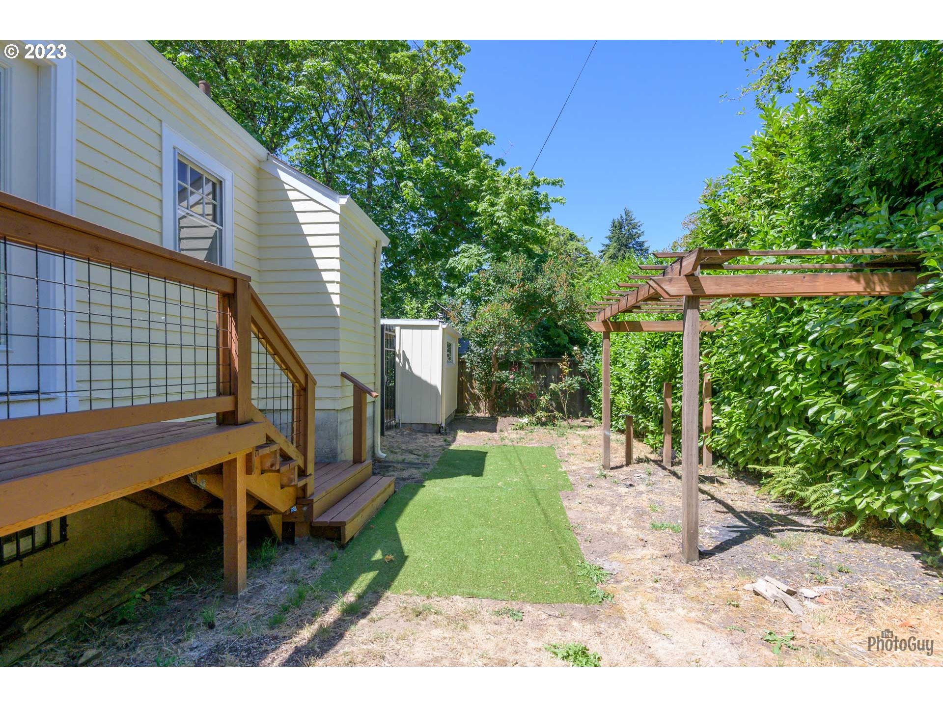 1041 Madison Street Eugene, OR 97402 - Photo 26 of 34 a view of a backyard with sitting area