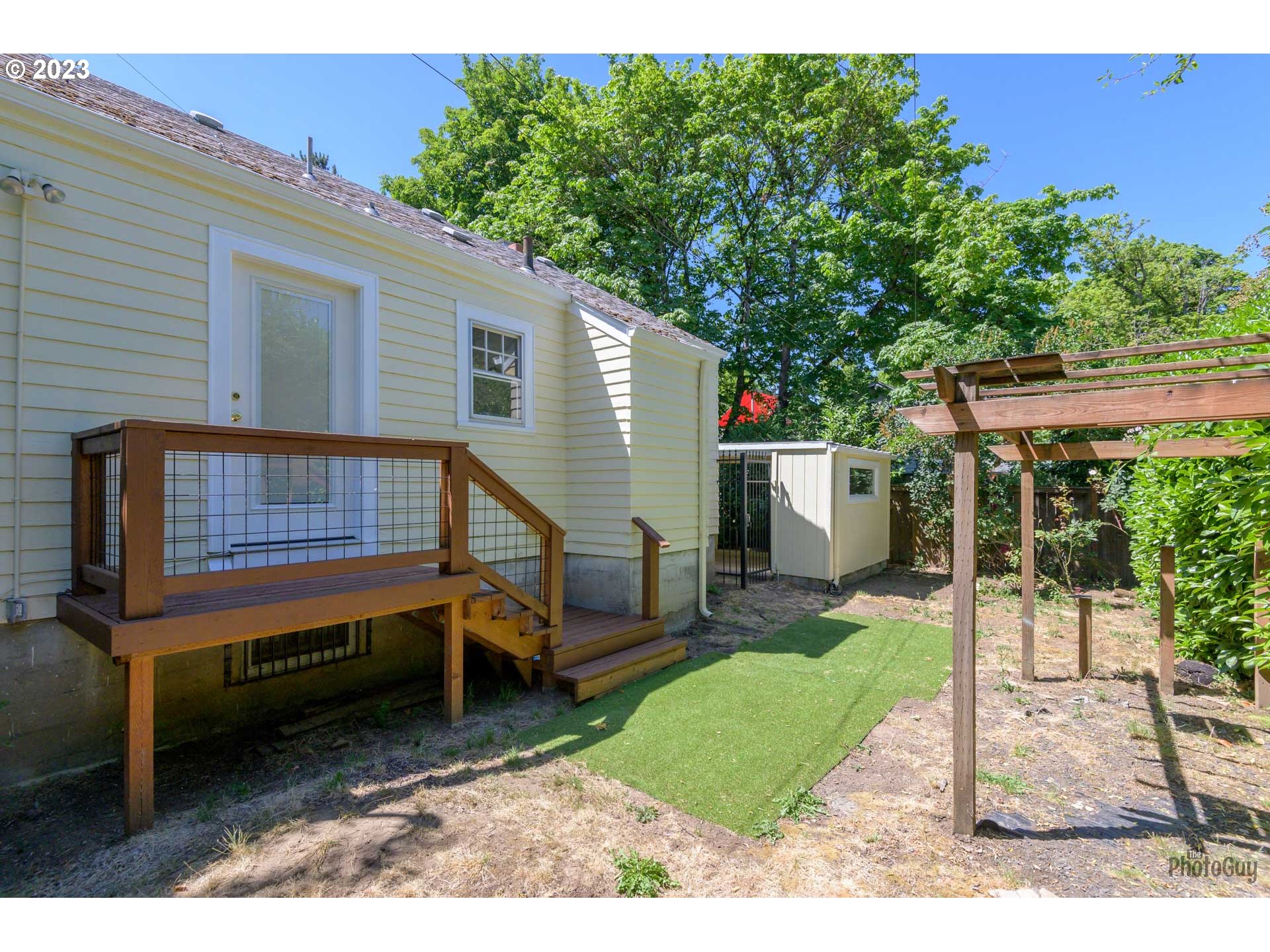 1041 Madison Street Eugene, OR 97402 - Photo 27 of 34 a backyard of a house with barbeque oven table and chairs