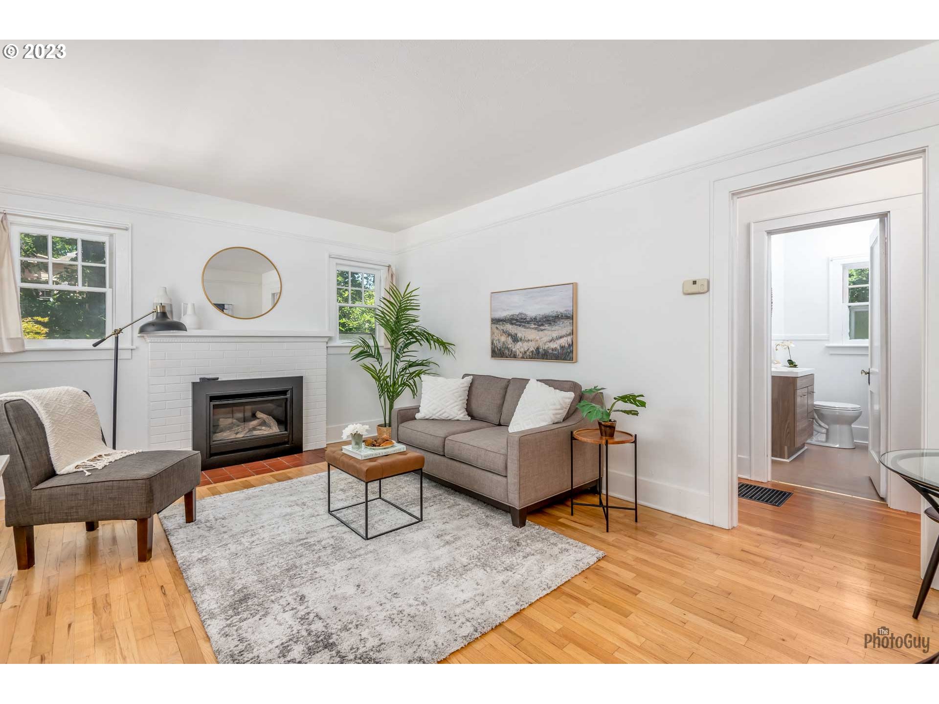 1041 Madison Street Eugene, OR 97402 - Photo 5 of 34 a living room with furniture and a fireplace
