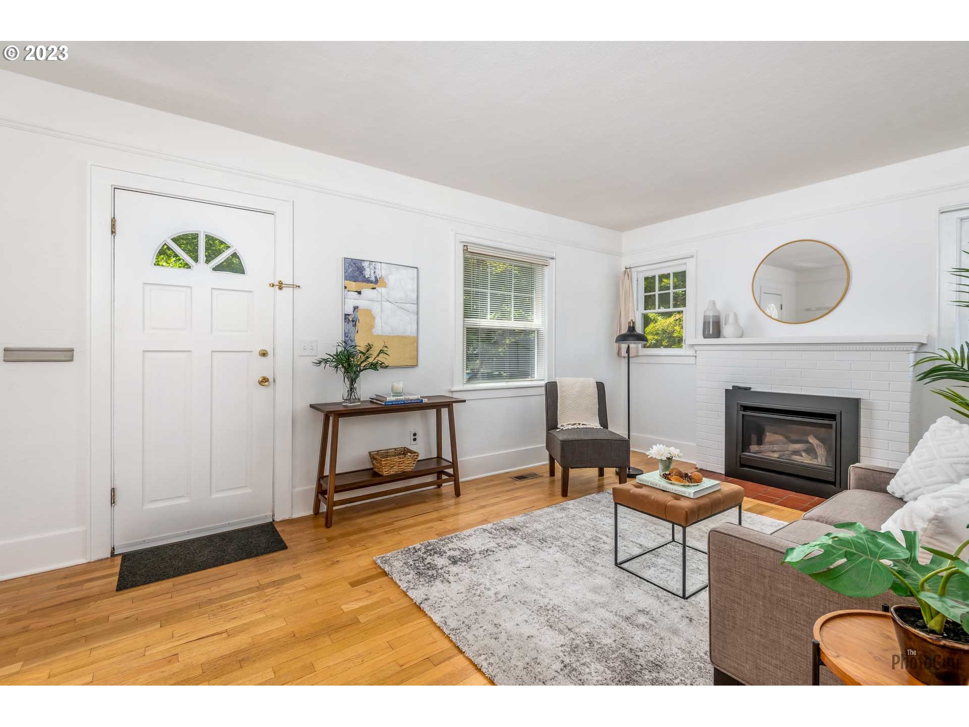 1041 Madison Street Eugene, OR 97402 - Photo 6 of 34 a living room with furniture and a fireplace