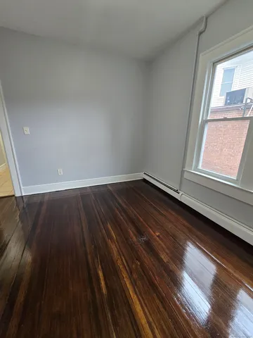 a view of an empty room and glass door