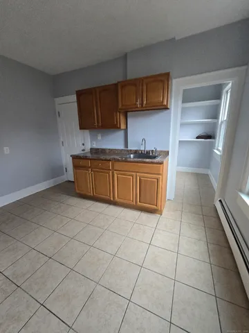 a kitchen with stainless steel appliances granite countertop a sink and cabinets