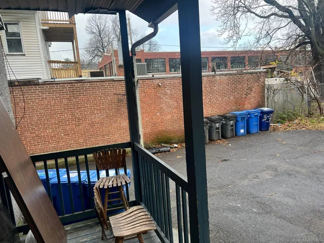 a view of balcony with wooden floor