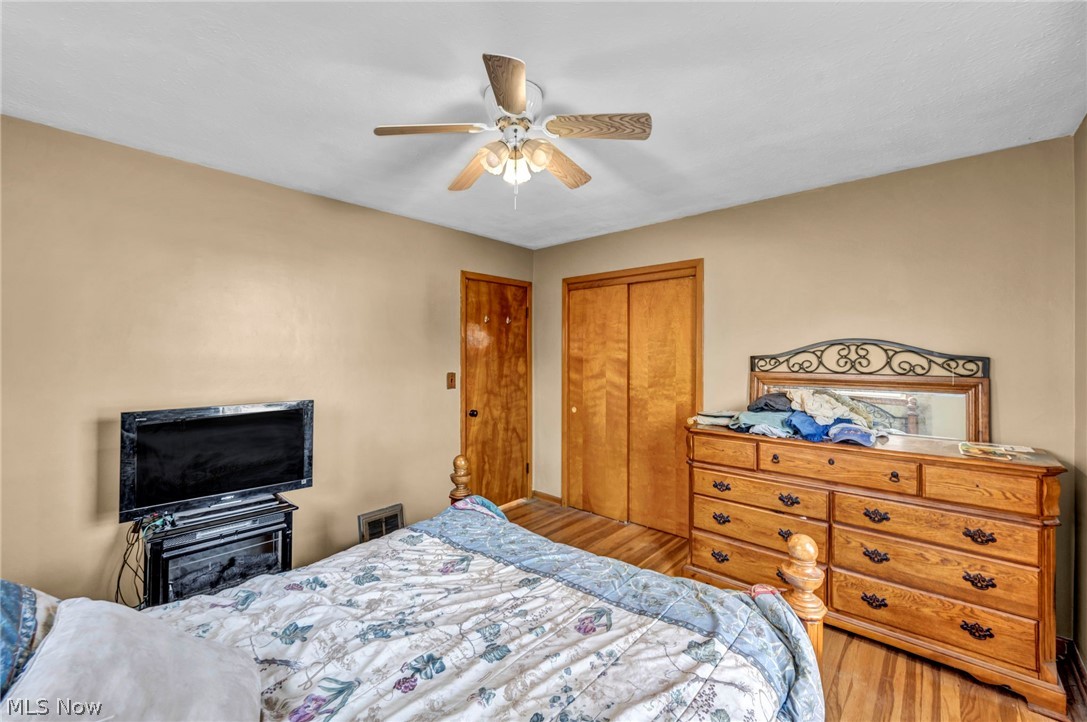 30002 Barjode Road Willowick, OH 44095 - Photo 21 of 33 Bedroom with a closet, wood finished floors, and ceiling fan