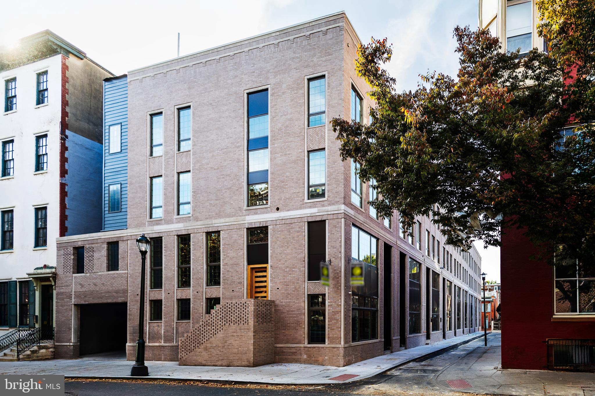 1114 Cypress Street Philadelphia, PA 19107 - Photo 63 of 63 a front view of a building with glass windows and plants