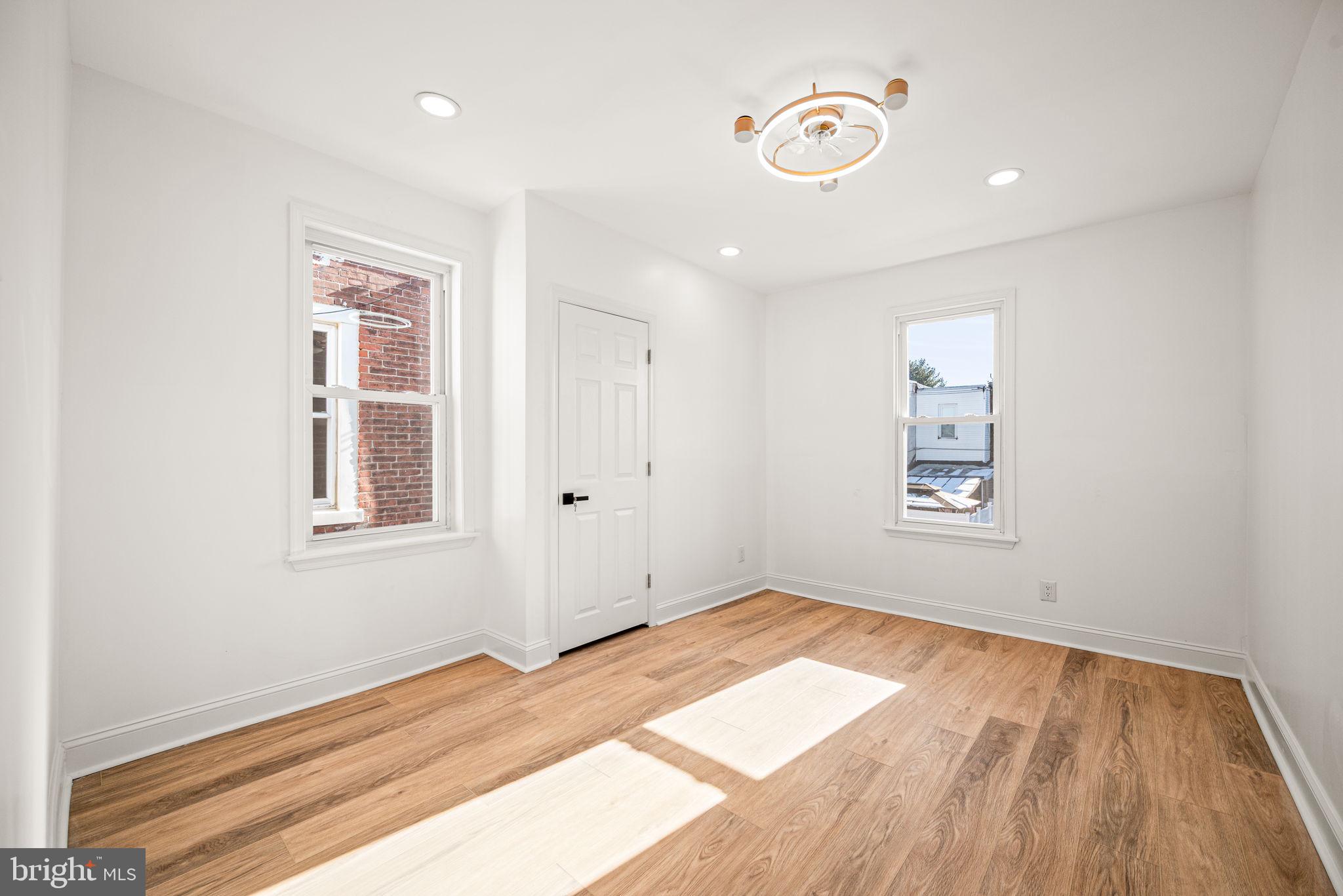6128 Chestnut Street Philadelphia, PA 19139 - Photo 9 of 10 a view of a room with wooden floor and window