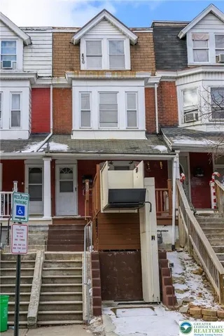 a front view of a house with glass windows