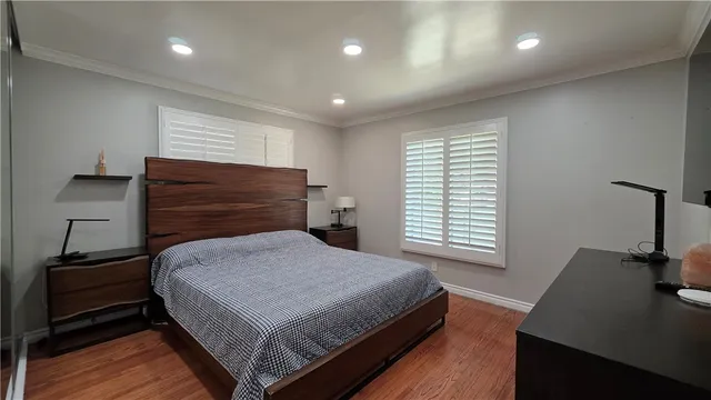 a bedroom with a bed and a desk