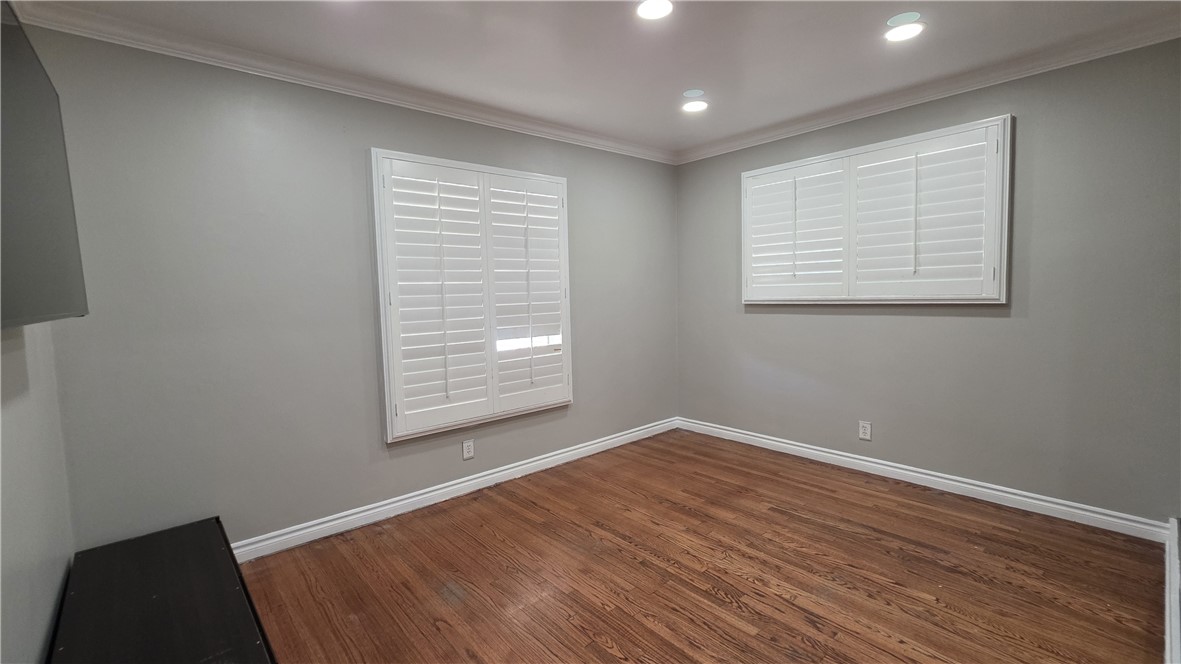 6637 Capps Avenue Reseda, CA 91335 - Photo 16 of 23 a view of an empty room with wooden floor and a window