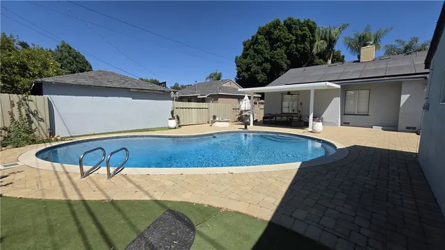 a view of a swimming pool with a patio
