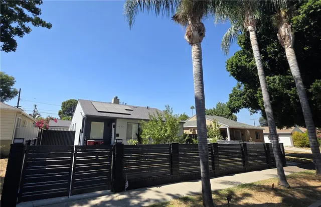 a view of a house with a tree