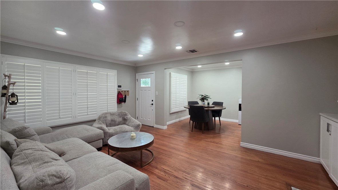 6637 Capps Avenue Reseda, CA 91335 - Photo 7 of 23 a living room with furniture and wooden floor