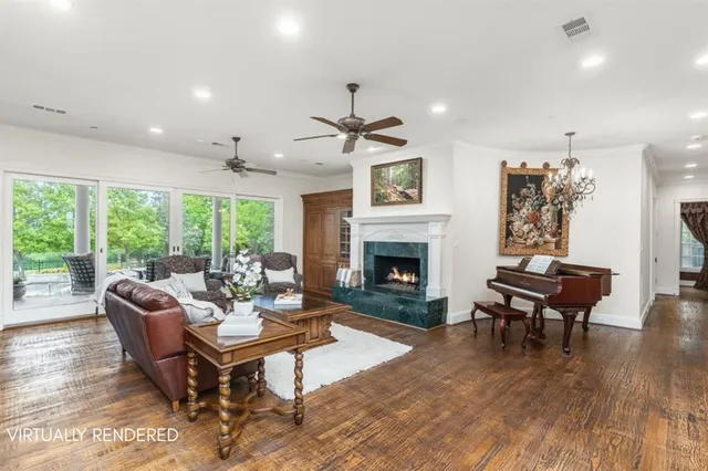 a living room with furniture a fireplace and a table