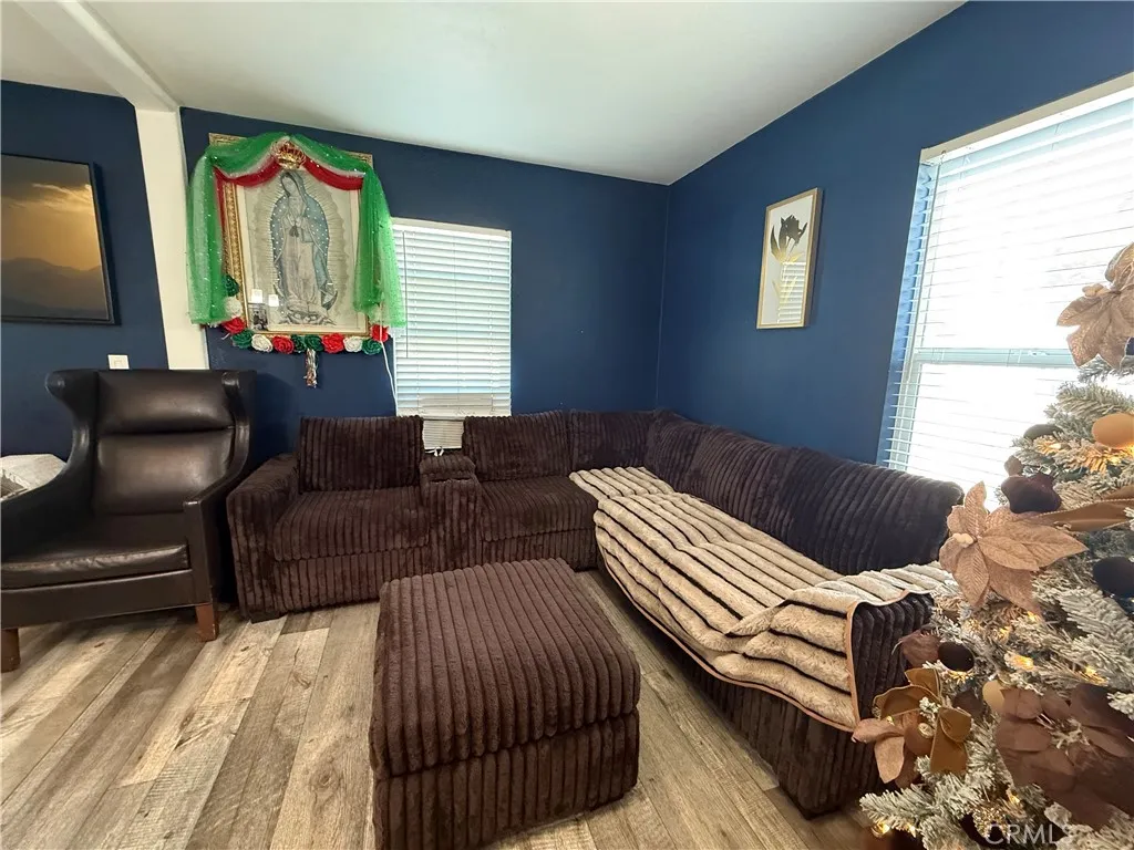 12700 Elliott, Unit 10 El Monte, CA 91732 - Photo 16 of 30 a living room with furniture and a large window