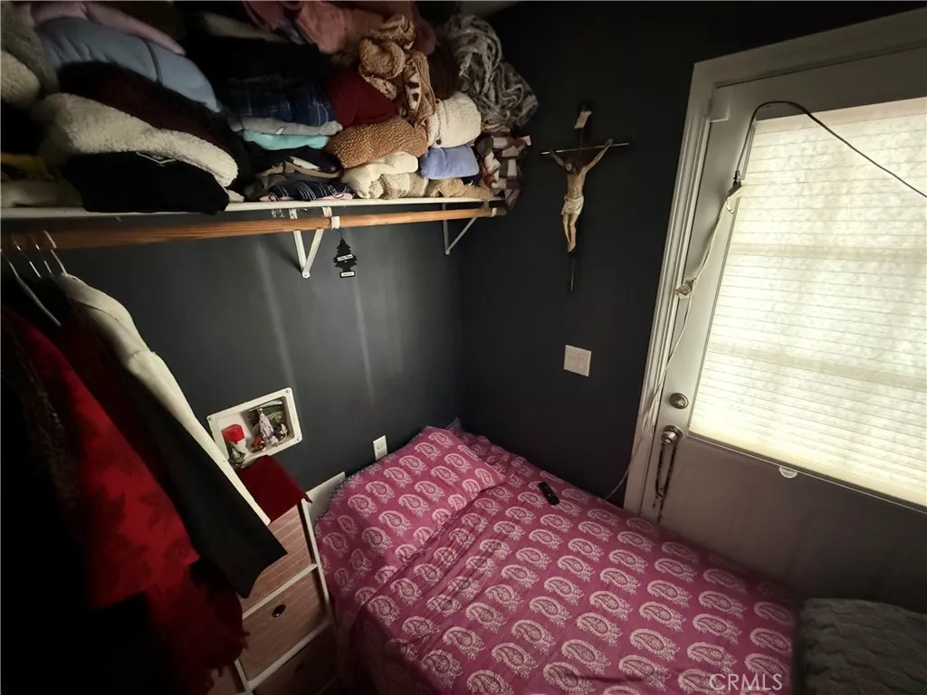 12700 Elliott, Unit 10 El Monte, CA 91732 - Photo 17 of 30 a bedroom with a bed and a window