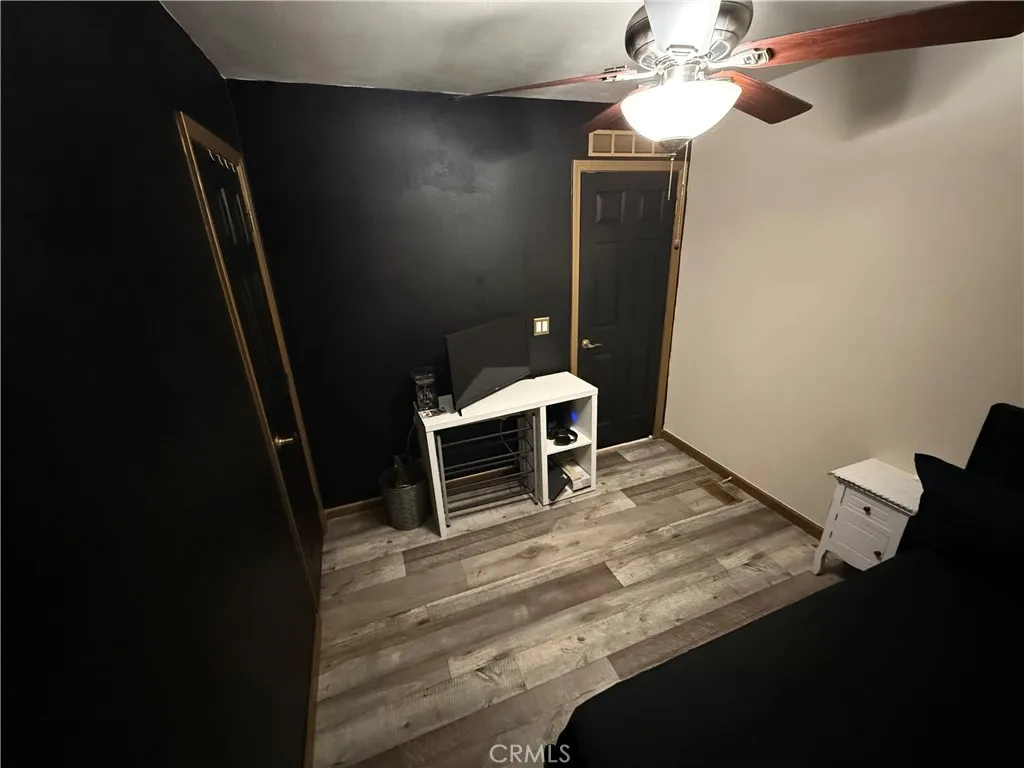 12700 Elliott, Unit 10 El Monte, CA 91732 - Photo 22 of 30 a view of a room with wooden floor and fan