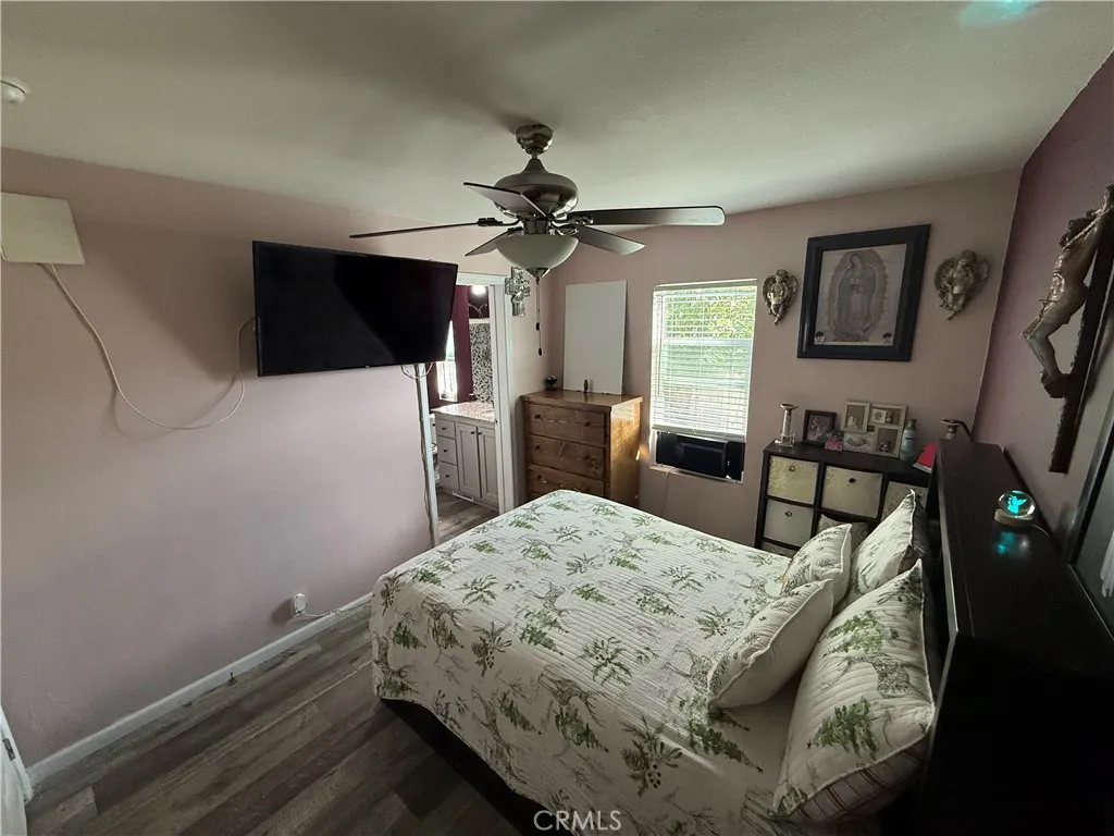 12700 Elliott, Unit 10 El Monte, CA 91732 - Photo 26 of 30 a bedroom with a bed and a flat screen tv