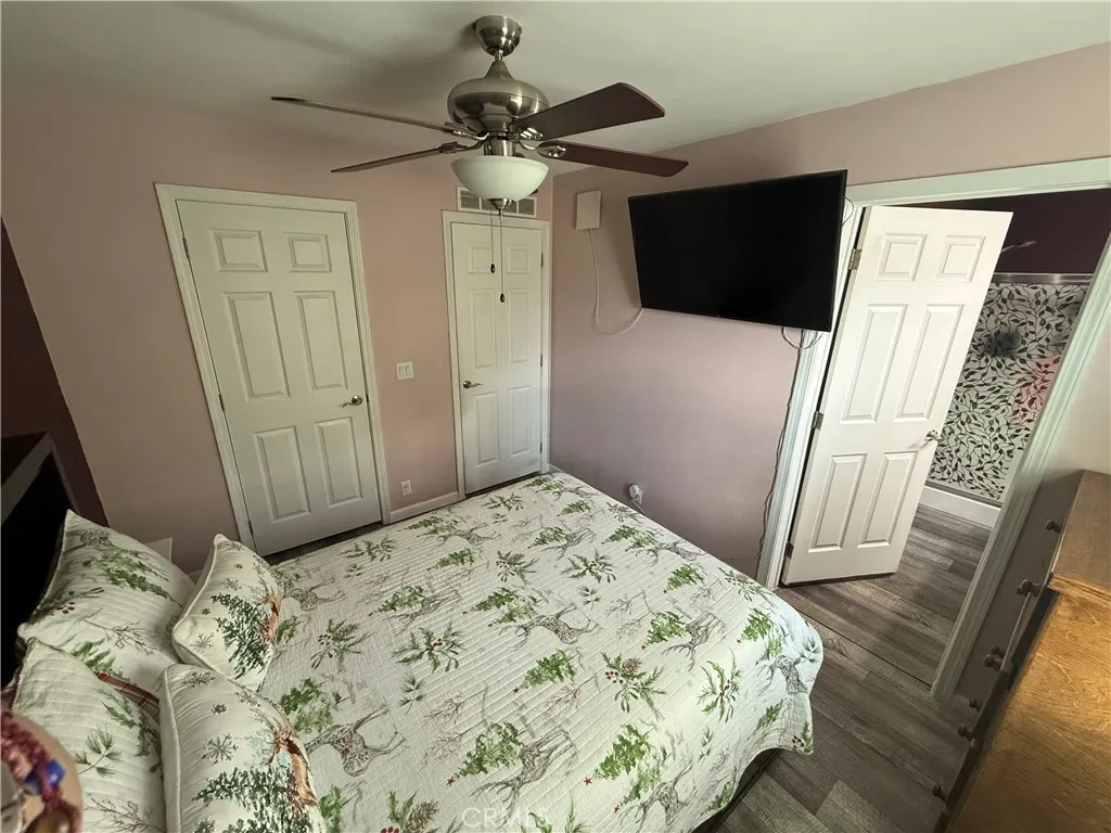 12700 Elliott, Unit 10 El Monte, CA 91732 - Photo 27 of 30 a bedroom with a bed and a flat screen tv