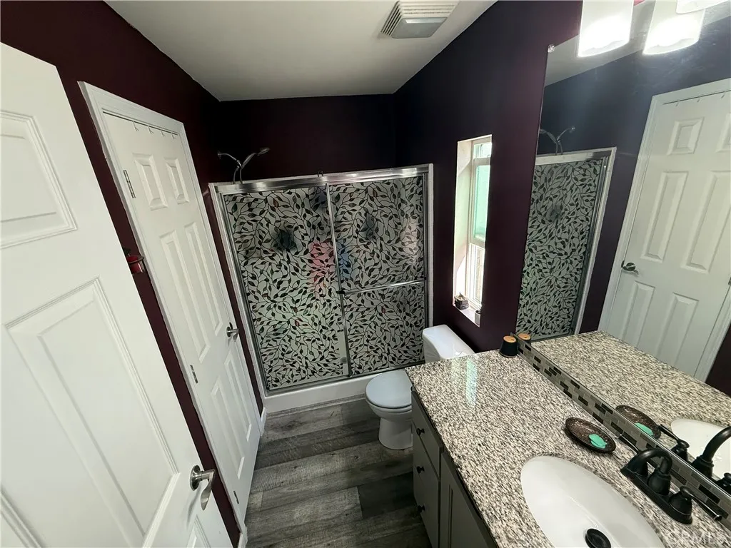 12700 Elliott, Unit 10 El Monte, CA 91732 - Photo 28 of 30 a bath room with a sink a mirror and shower