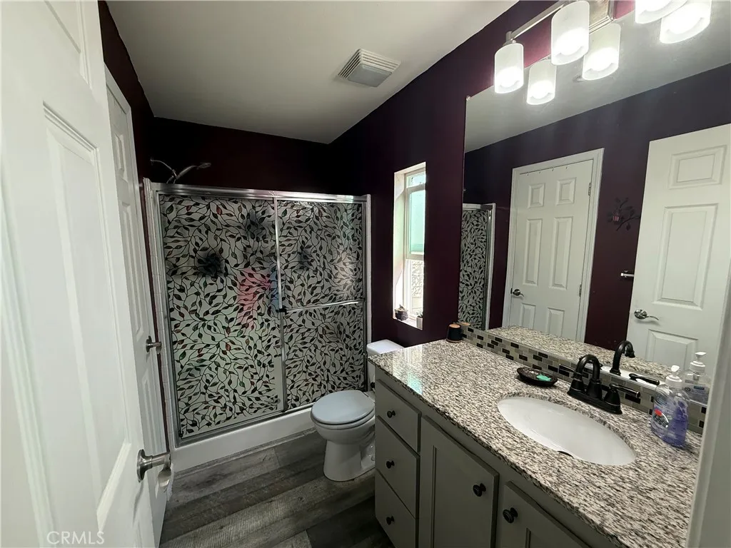 12700 Elliott, Unit 10 El Monte, CA 91732 - Photo 30 of 30 a bathroom with a granite countertop sink toilet and shower