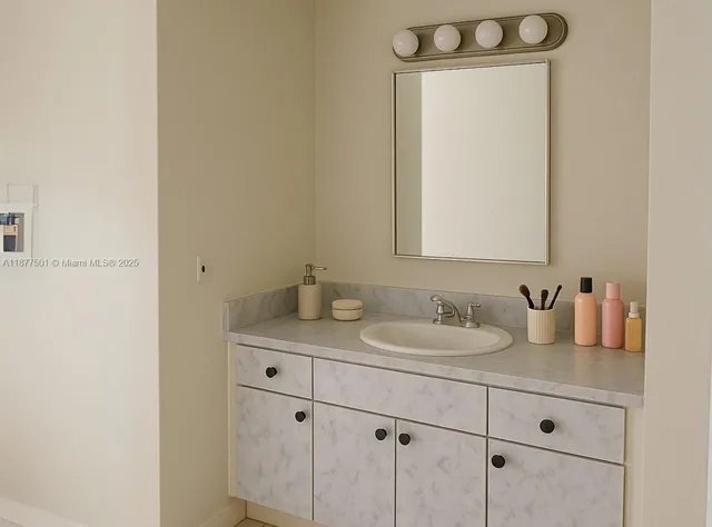 a bathroom with a sink and a mirror