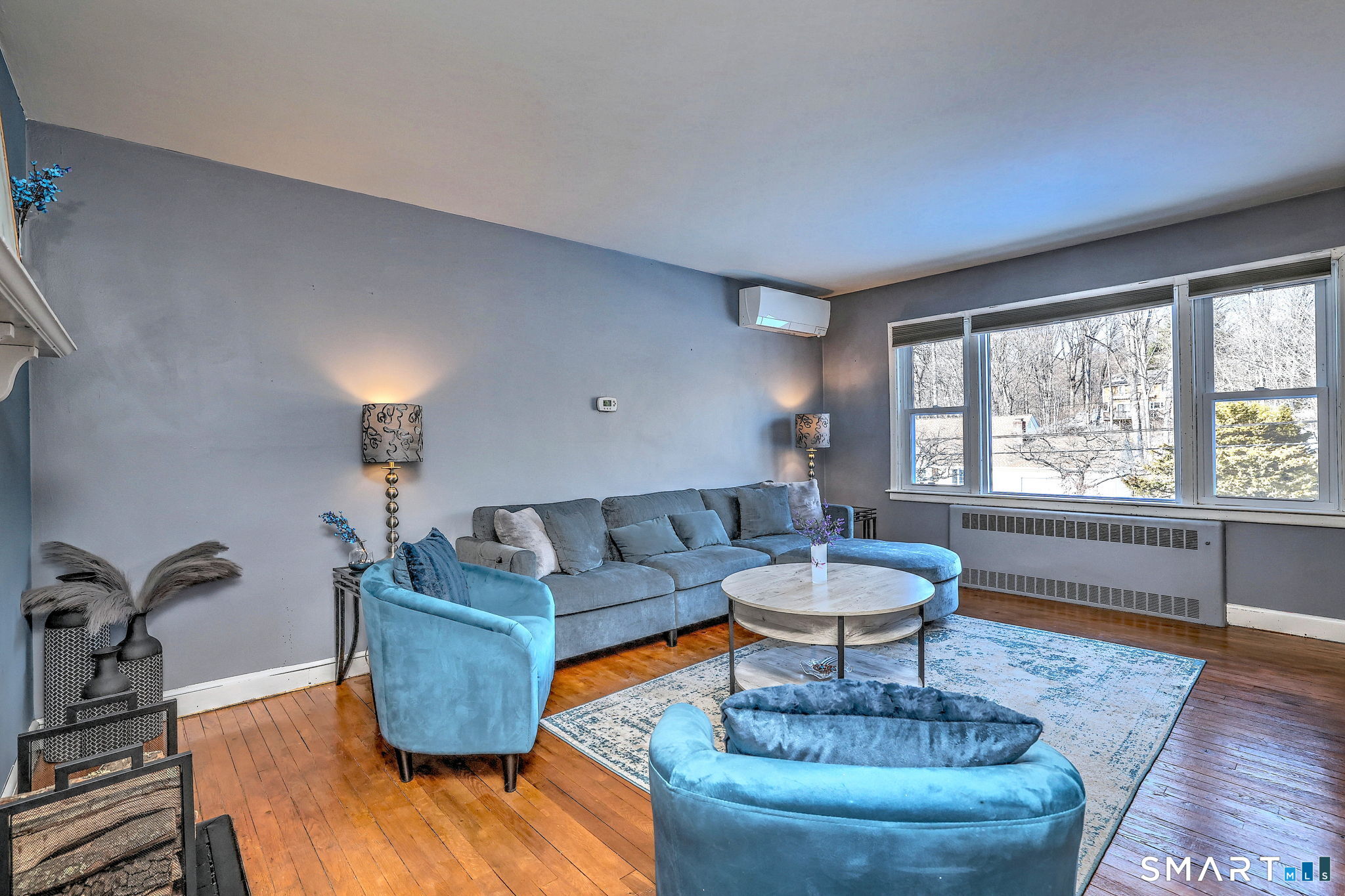 7 East Lake Road Trumbull, CT 06611 - Photo 15 of 42 a living room with furniture a window and a potted plant