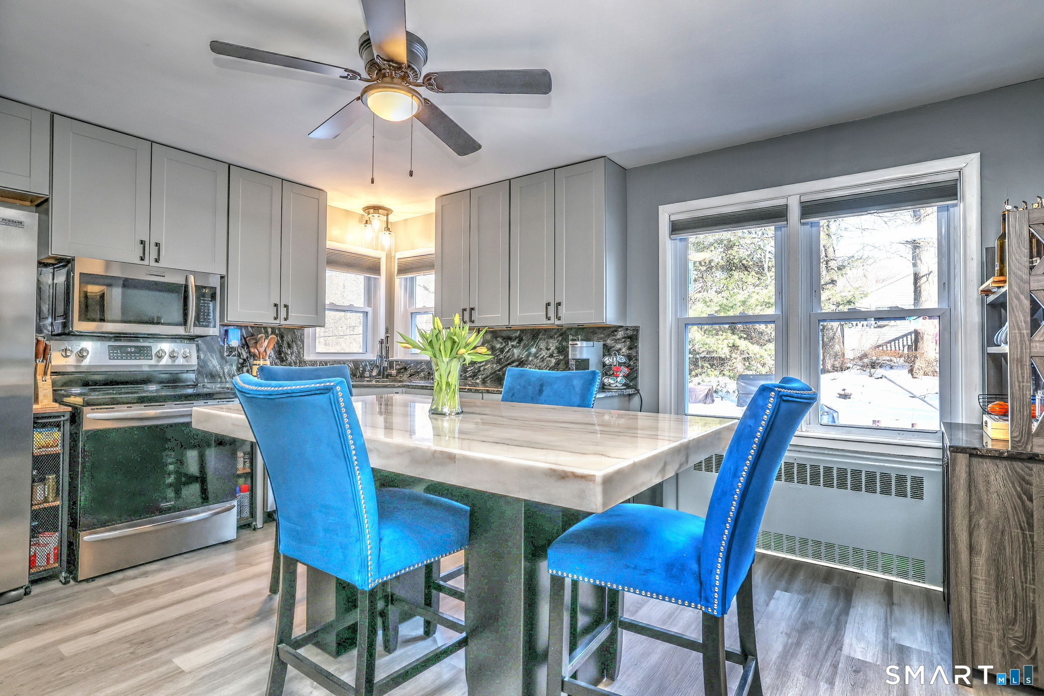 7 East Lake Road Trumbull, CT 06611 - Photo 17 of 42 a view of a dining room with furniture window and wooden floor