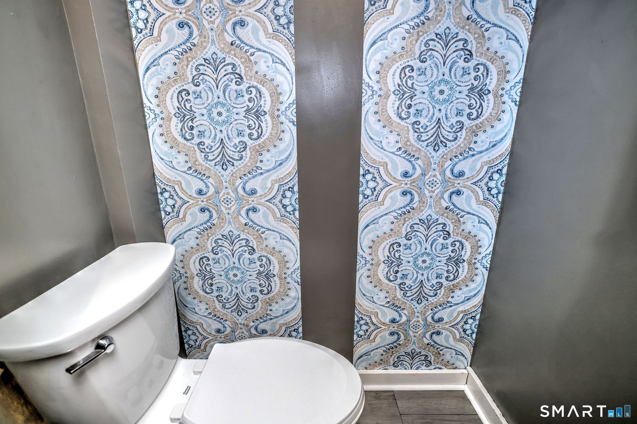 7 East Lake Road Trumbull, CT 06611 - Photo 24 of 42 a white toilet sitting next to a shower curtain