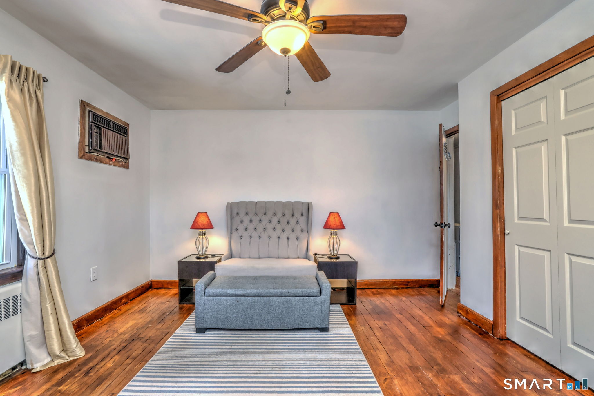 7 East Lake Road Trumbull, CT 06611 - Photo 27 of 42 a bedroom with furniture and a chandelier