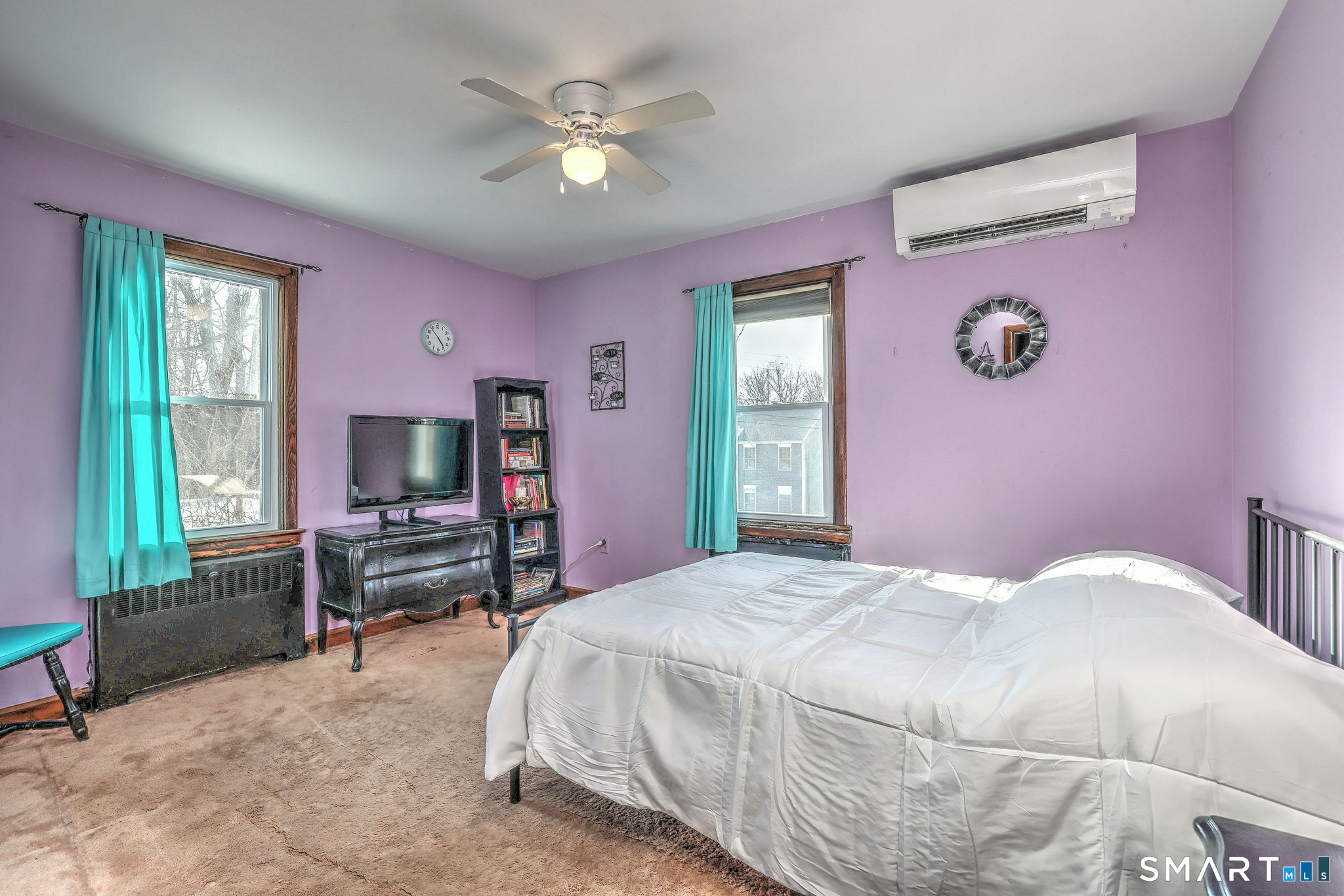 7 East Lake Road Trumbull, CT 06611 - Photo 30 of 42 a bedroom with a bed and a tv on table