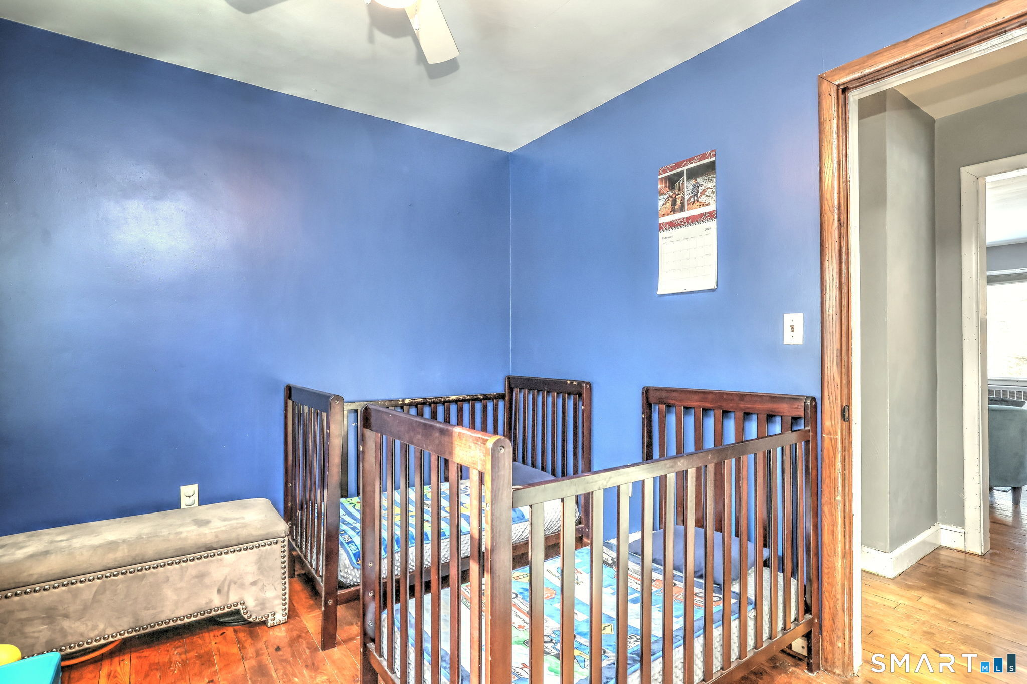 7 East Lake Road Trumbull, CT 06611 - Photo 32 of 42 a bedroom with a bed and wooden floor