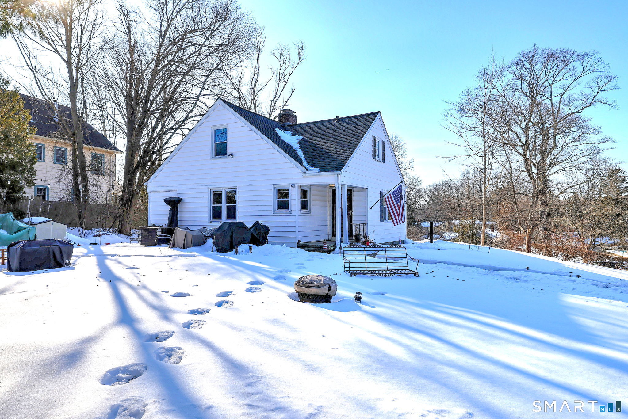 7 East Lake Road Trumbull, CT 06611 - Photo 6 of 42 a view of a house with snow on the road