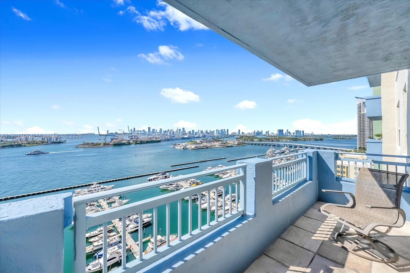 90 Alton Road, Unit 2002 Miami Beach, FL 33139 - Photo 11 of 20 a view of a balcony with furniture