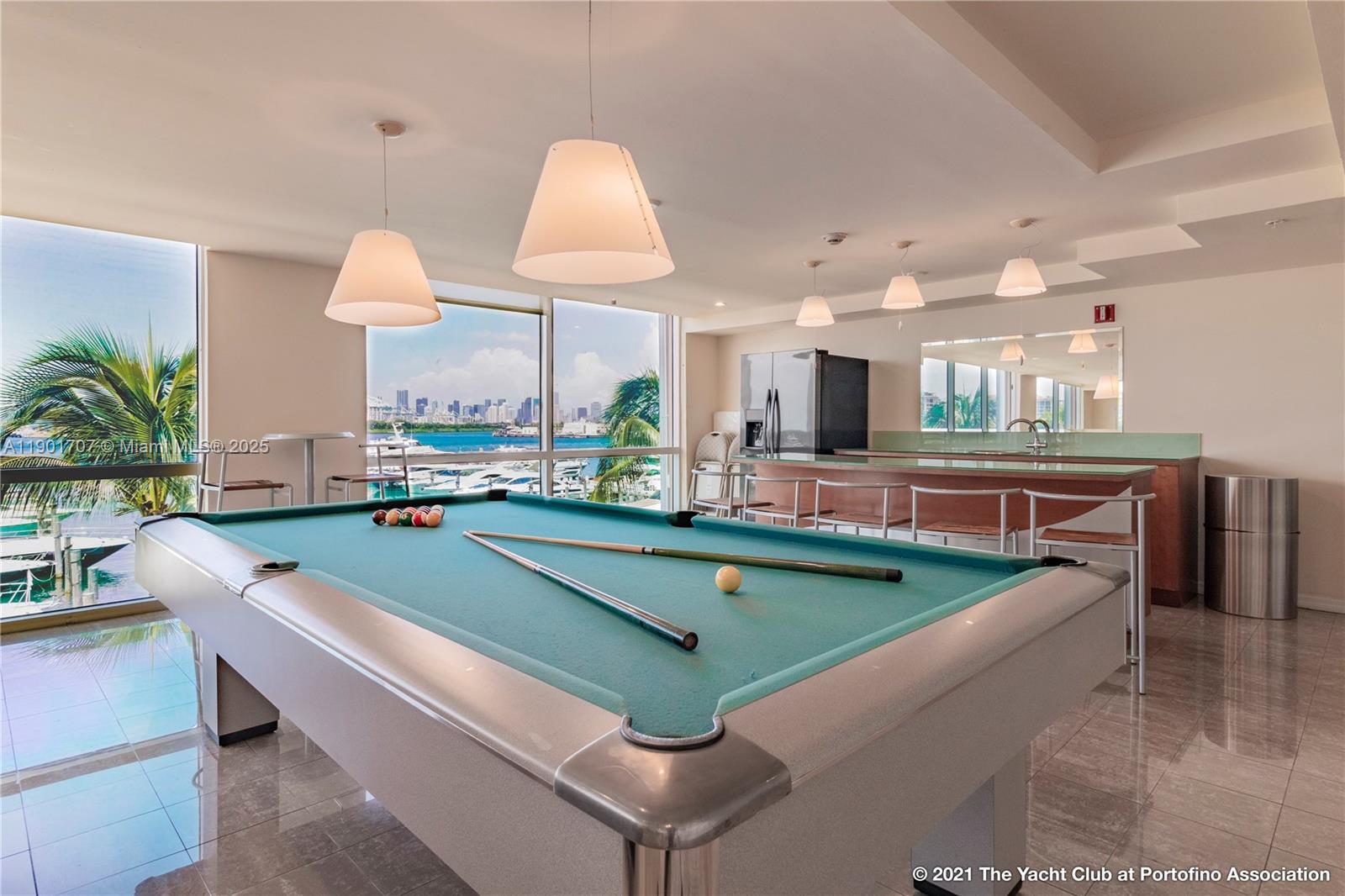 90 Alton Road, Unit 2002 Miami Beach, FL 33139 - Photo 16 of 20 a view of a living room and kitchen