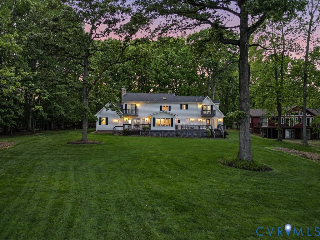 173 Covenant Way Bumpass, VA 23024 - Photo 55 of 63 Expansive green lawn surrounds this white exterior