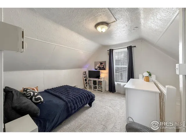 a view of a house with a yard covered in snow