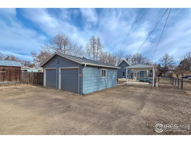 a house that has a tree in front of it