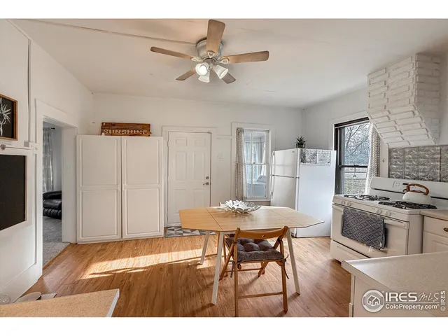 a living room with stainless steel appliances kitchen island granite countertop furniture and a kitchen view
