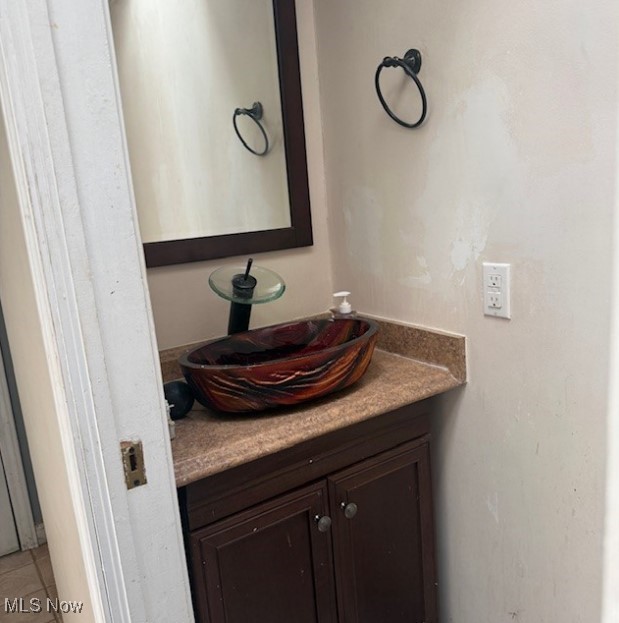 2916 Sexton Road Geneva, OH 44041 - Photo 13 of 23 Bathroom featuring vanity and tile patterned flooring
