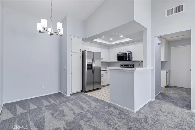 a kitchen with a sink stove and microwave