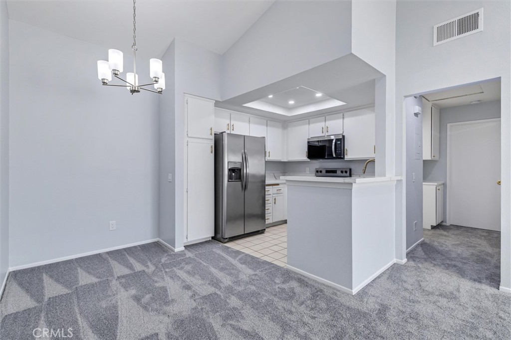 78 Costero Aisle, Unit 301 Irvine, CA 92614 - Photo 12 of 38 a view of a kitchen with a sink