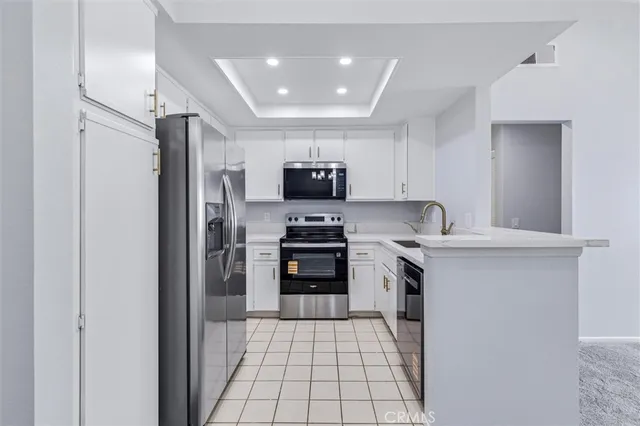 a kitchen with a sink cabinets and window