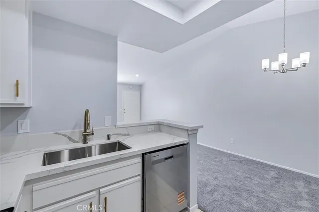 a bedroom with bed and painting on the wall