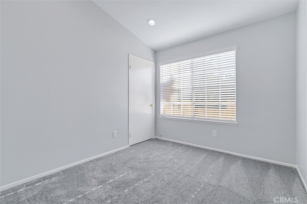 78 Costero Aisle, Unit 301 Irvine, CA 92614 - Photo 25 of 38 a view of an empty room with a window