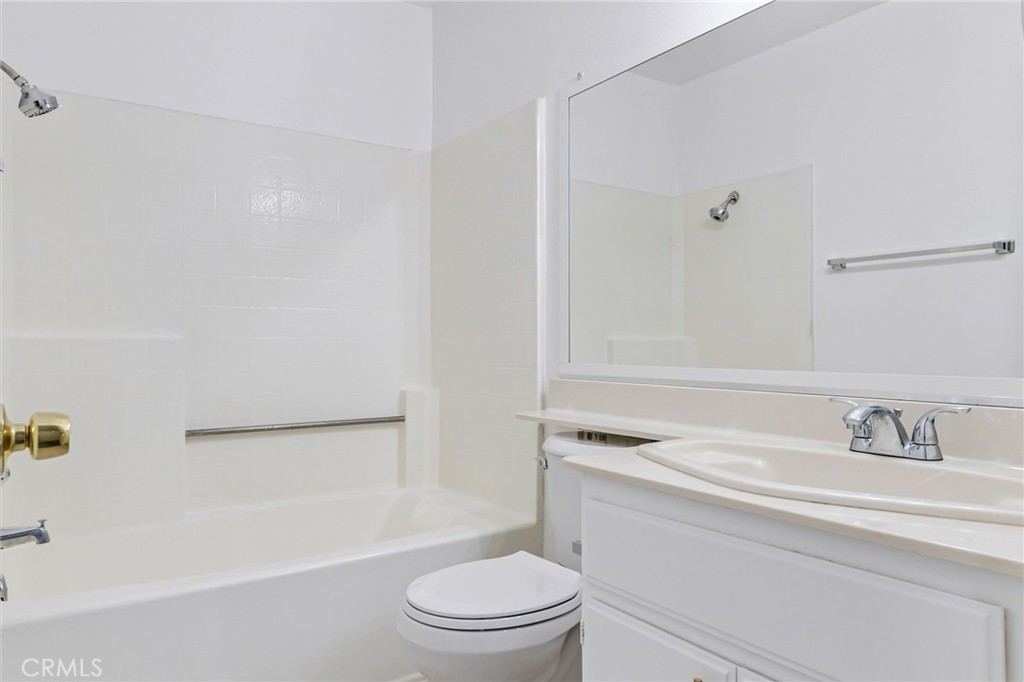 78 Costero Aisle, Unit 301 Irvine, CA 92614 - Photo 30 of 38 a bathroom with a sink a toilet and a bathtub