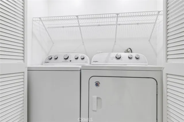 a view of pool and trees in the background