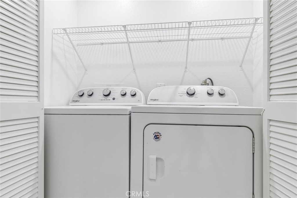 78 Costero Aisle, Unit 301 Irvine, CA 92614 - Photo 31 of 38 a utility room with dryer and washer