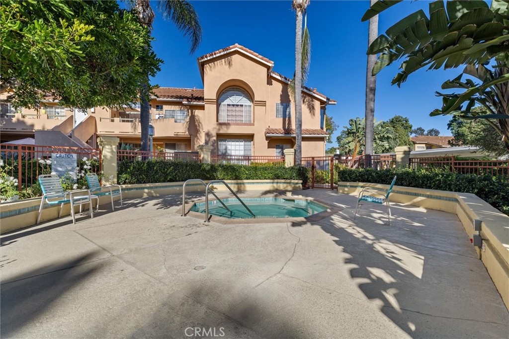 78 Costero Aisle, Unit 301 Irvine, CA 92614 - Photo 32 of 38 a view of multiple houses with a yard