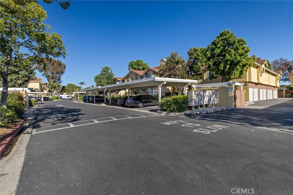 78 Costero Aisle, Unit 301 Irvine, CA 92614 - Photo 36 of 38 a car parked on the side of the street